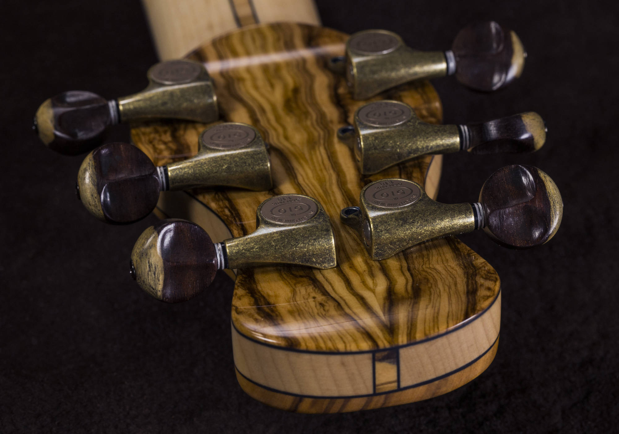 Recurve Headstock and Custom Sculpted Tuner Buttons